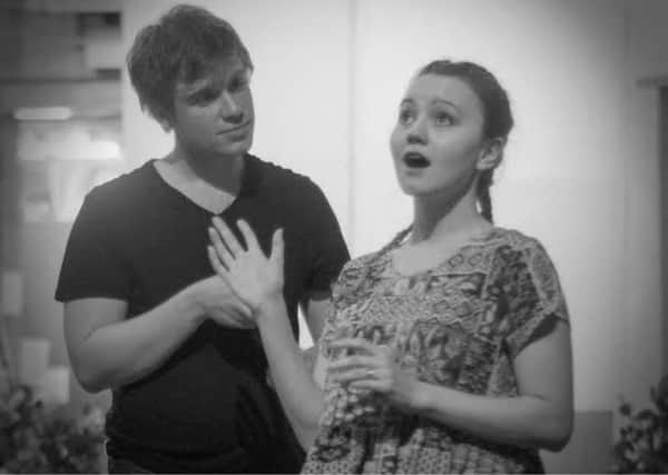 Joe Riley and Rose Kenny rehearsing as Algernon and Cecily respectively