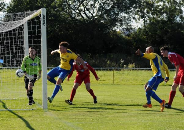Chris Conway bundles home Southam's equaliser against Stafford Town on Saturday. Picture: Morris Troughton
