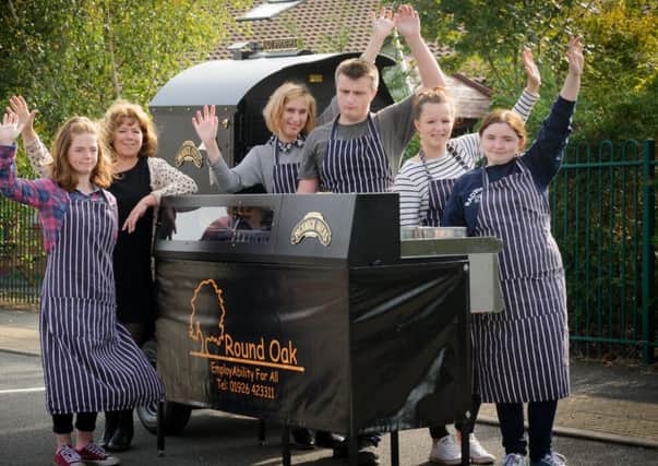 Sixth formers at Round Oak School, are running a mobile baked potato oven as a business and are looking for a venue from which to sell the potatoes. Pictured: Sixth formers together with headteacher Jane Naylor.