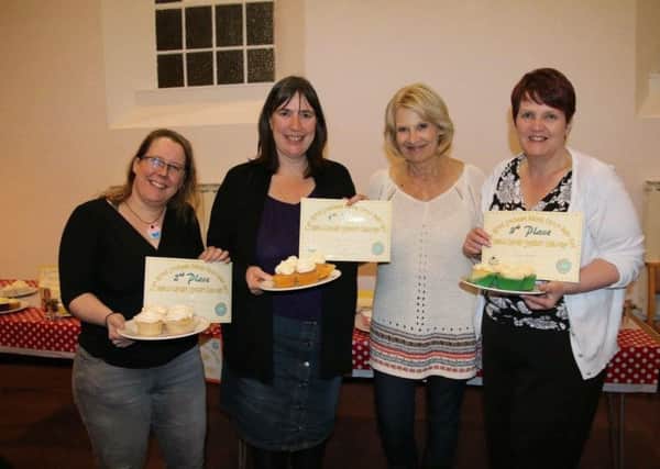 Former Great British Bake Off contestant Christine Wallace with Southam Baking Circle vanilla cupcake competition winners Claire Thorpe, Emma Tysoe Griffiths and Mandy Rowlatt.