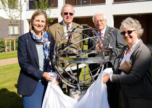 Queensway Courts commemorative sundial is unveiled by Orbit Group chairman Baroness Tessa Blackstone, Orbit Group Chair and Warwick District Council chairman Cllr Michael Doody, with Queensway Court residents David and Mary Davies.