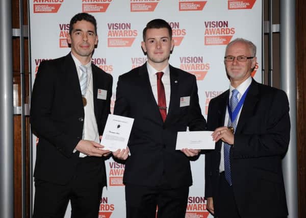 Christopher Steel, centre, receives the Institution of Mechanical Engineers (IMechE) Whitworth Scholarship Award.