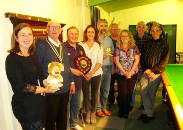 Pictured at the presentation are Rachel Ollerenshaw of Molly Olly's Wishes, Barry Frith President of Leamington Rotary, crew member Trevor Lewis holding the shield, Charlene Cole of theplasticshop.co.uk of Coventry - the raft's sponsors, crew member and raft designer Mark Allen, Rachael Stevens of The Myton Hospices, and crew members Mike Haynes, Dennis O'Keeffe and Chris Langley.