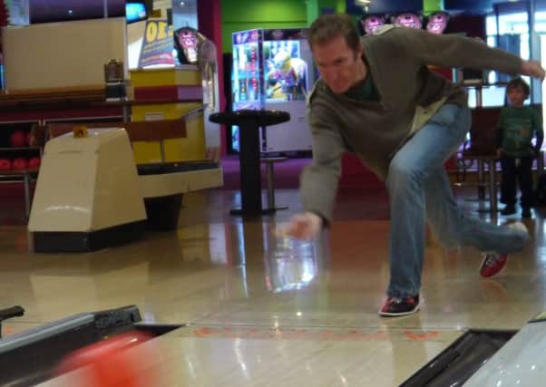Derek Reynolds practising for his ten-pin bowling challenge.