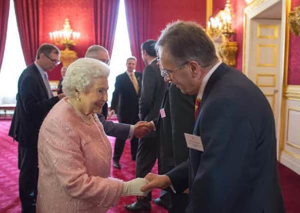 Clive Harridge with Her Majesty the Queen.