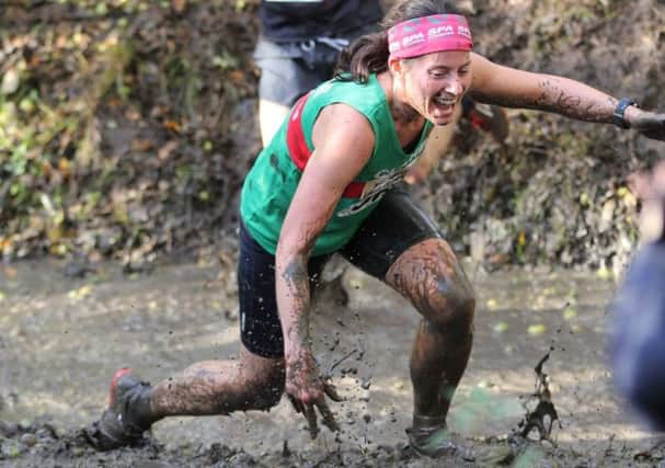 Spa Striders' Clare Hinton stumbles her way out of the ditch in the ladies' race. Picture: Tim Nunan