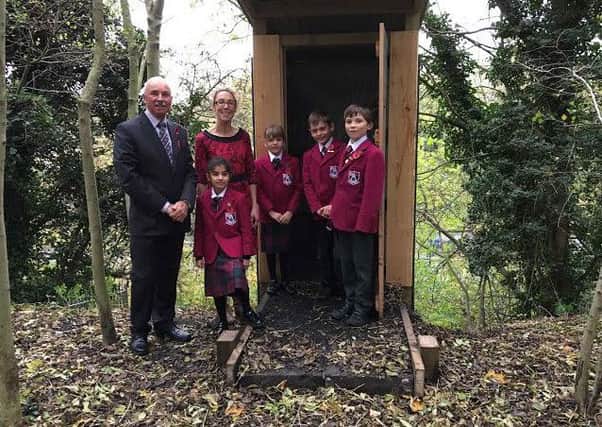 Arnold Lodge pupils at the compost toilet at Foundry Wood, with Friends of Foundry Wood chairman Kristie Naimo.