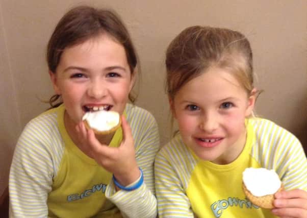 Kenilworth Brownies Alice and Teia enjoying their Bonfire night treat of hot chocolate and Smores.