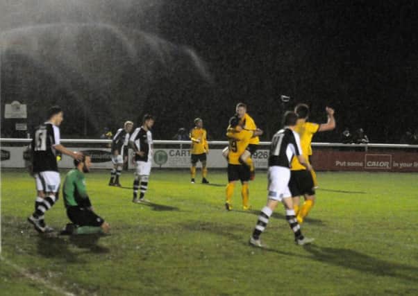 Ben Mackey is congratulated after scoring Brakes' third goal at home to Hednesford Town on Saturday. Picture: Morris Troughton