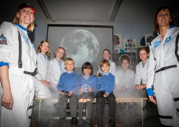 Warwick prep pupils and science teachers with the moon and meteorites.