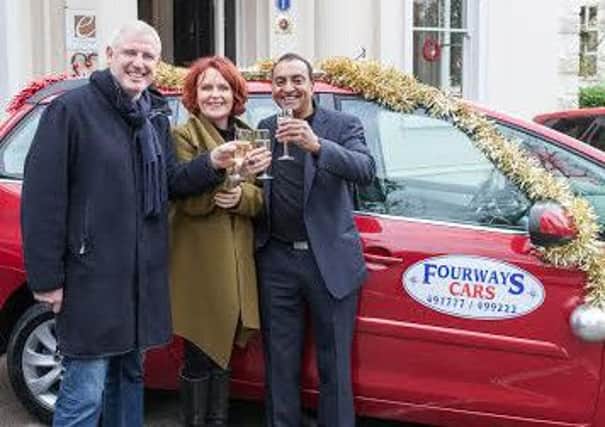 Episode Hotel owner Ian Ferguson prepares for the Christmas lunch with Age UK Warwickshire's fujndraising manager Linda OSullivan and Fourways Taxis owner Suki Matharu. Picture by John Cleary Photography.