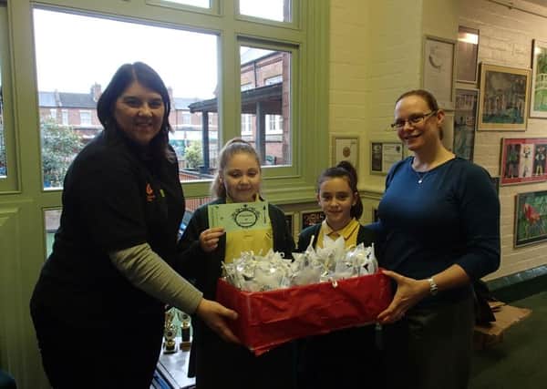 Julie Williams of Charlecote park and teacher Rachael Daniels with pupils at Shrubland Street primary School.