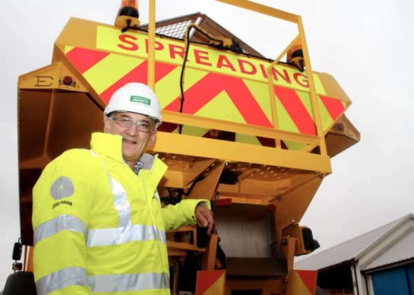 Cllr Peter Butlin with a council gritting vehicle