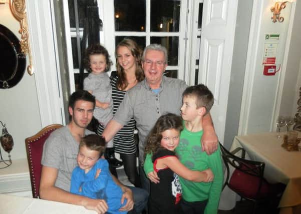 Colin Robinson and his grandchildren.