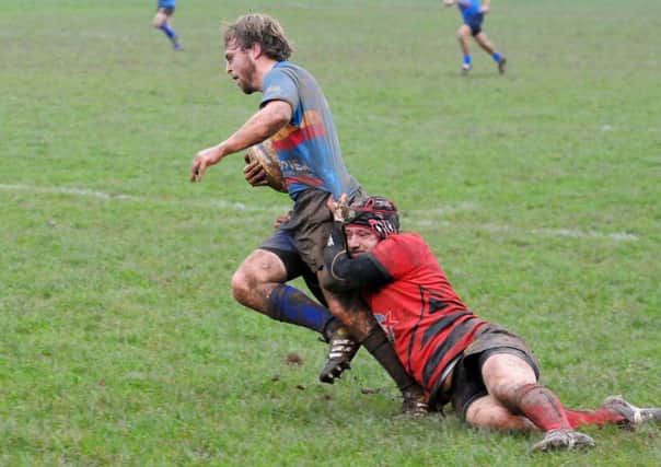 Leamington's Gareth Shuttleworth is tackled by Berkswell's Tom Marlow. Picture: Morris Troughton