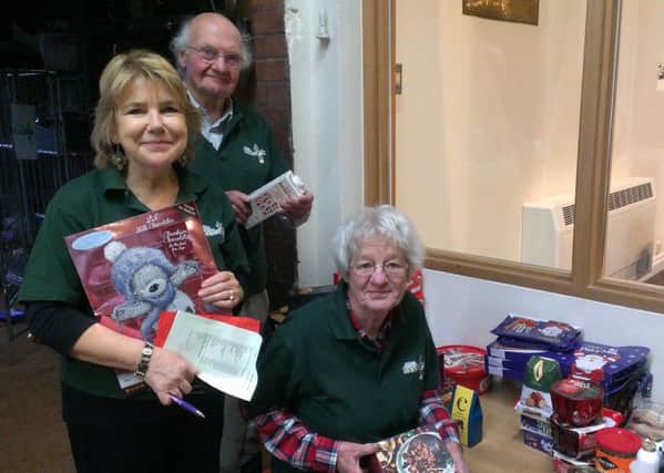 Foodbank volunteers with Christmas donations