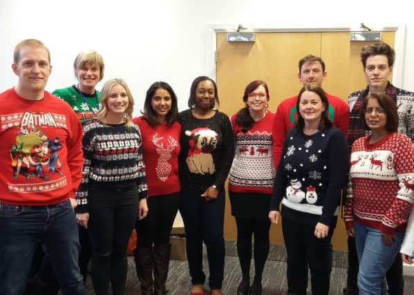 Staff at the Midcounties Co-operative during their Christmas jumper day