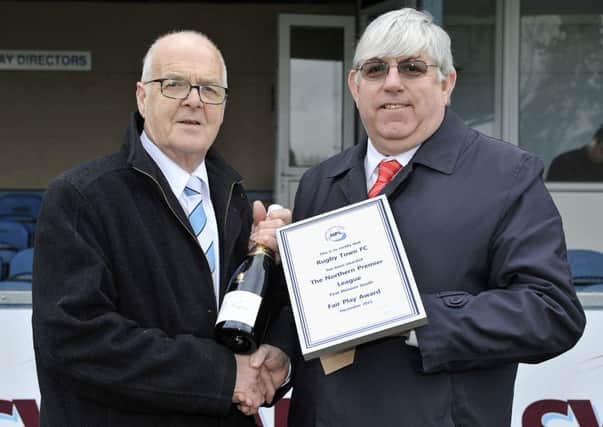 Rugby Towns secretary Doug Wilkins receives the Fair Play award from league representative John Goddard