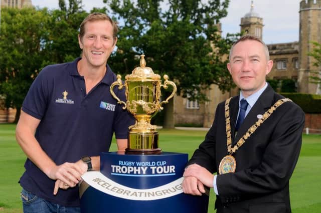 England star Will Greenwood and Rugby Mayor Cllr Richard Dodd with the Webb Ellis Cup at Rugby School