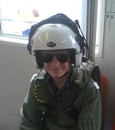 Harry May prepares to fly.
