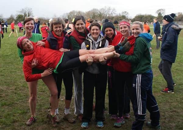 Spa Striders captain Bethan Gwynn is given a lift by her team-mates.