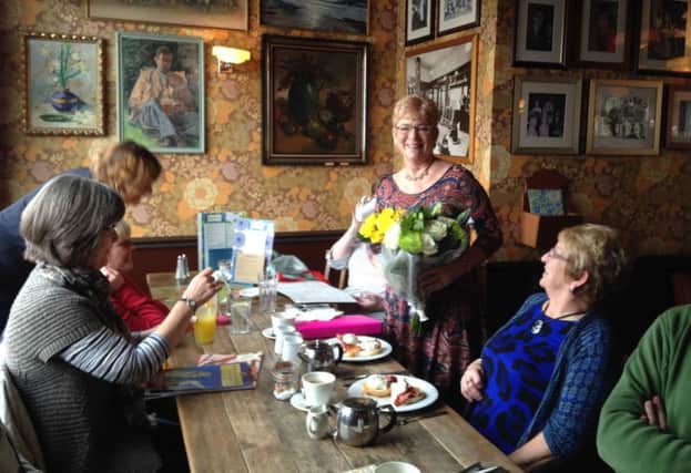 Rugby Social Group celebrated its first anniversary and presented leader Angie Lawrence with a bouquet