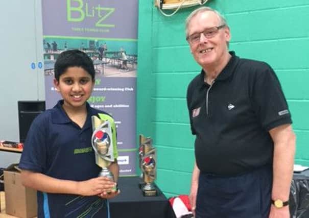 Nikit Sajiv receives his trophy for winning the Blitz 2-star tournament. Picture submitted