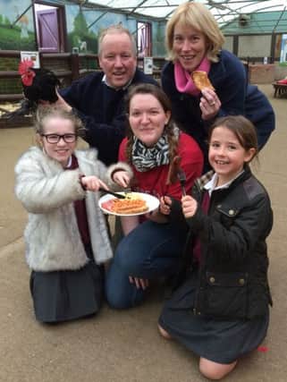 Ferncumbe school children Chloe Holdsworth (9 years old) and Evie Meeson (9 years old) from year 4 enjoying breakfast with Hatton Adventure World's Alice Latham (Centre), South Warwickshire NFU chairman Rupert Inkpen and NFU mutual agent and group secretary  Alison Price.