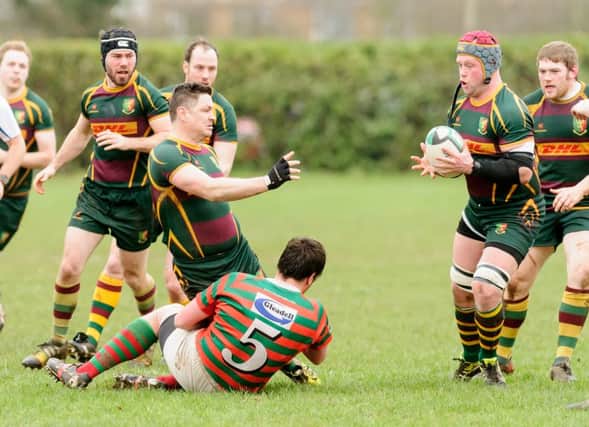 Glenn Todd with the ball, with (from left) Richard Paker, Dom Hammond, Andy Coleman, Ben Shepherd and Olly Cowley