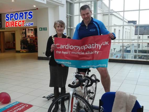 Leamington Mayor Cllr Amanda Stevens helps to promote Simon Storey's fundraising efforts at the Royal Priors shopping centre.