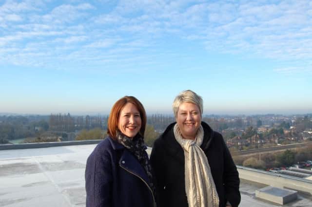 Sharon Taylor (l) and Sara French (r) at the top of a Warwickshire College building