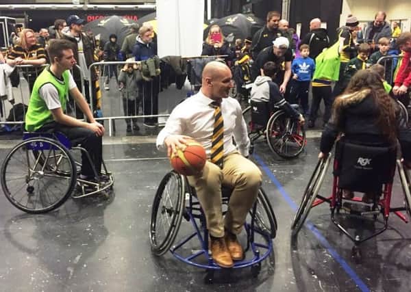 Wasps' Carlos Fustuccia has a go at wheelchair basketball. Pictures submitted