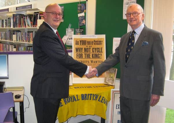 David Moscow and Francis Arnold shake hands after opening the display in Kenilworth Library. Photo courtesy of Reg Grogan