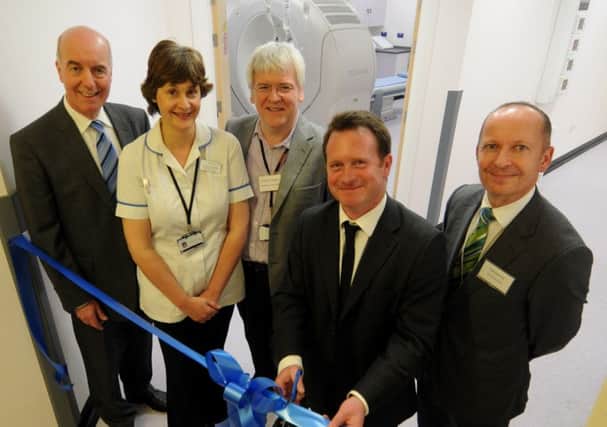 Chris White MP and Warwick Hospital's chief executive Glen Burley with staff at the official opening of the hospital's radiology department in 2011.