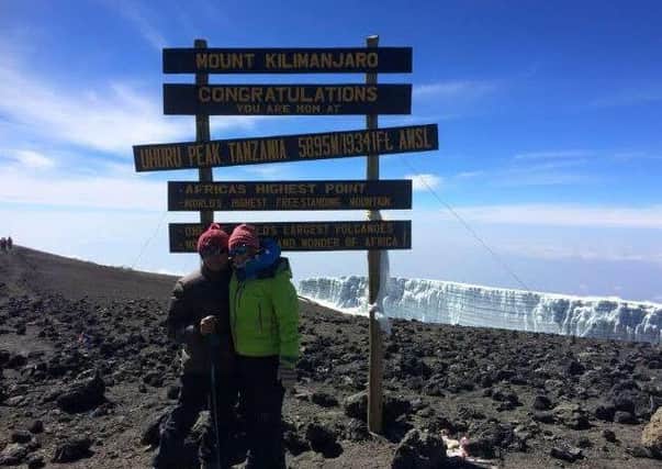 Kam and Carlee at the summit of Kilimanjaro on New Year's Day last year.