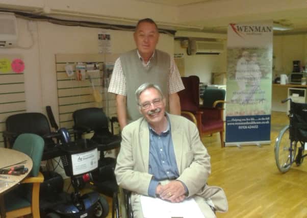 Cllr David Greenwood (back) and Cllr Bill Gifford at Shopmobility in Leamington.
