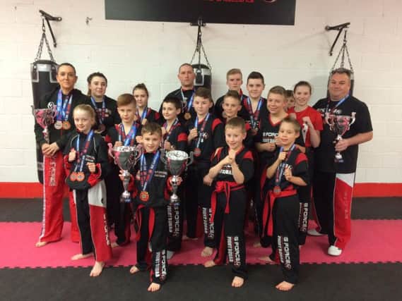 G Force fight squad with their trophies and medals