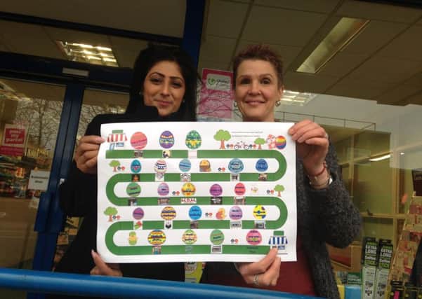 Mandy Dass, director of Kenilworth News in Station Road, and Judy Brook, owner of Kenilworth Books, with the trail map