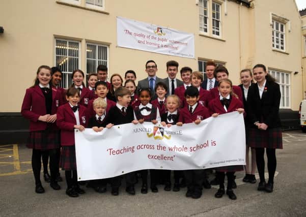 Dai Preston (Head of Senior School) and pupils celebrate Arnold Lodge  school's performance in the league tables mhlc-15-03-16-Arnold Lodge NNL-160315-173628009