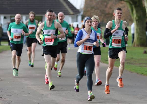 Leamington C&AC's Natalie Bhangal finds herself pursued by a green army of Kenilworth Runners at the Massey Easter 5 on Sunday. Picture: Tim Nunan