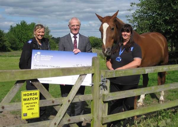 Carol Cotterill, chairman of Warwickshire Horse Watch with PSCO Lauren Hughes and Warwickshire Police and Crime Commissioner Ron Ball.