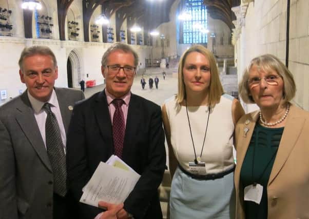 Peter Realf, Mark Pawsey MP, Maria Lester and Liz Realf at Westminster. Photo: Brain Tumour Research. NNL-160420-110233001