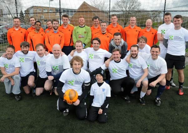 Sydenham Primary School teacher Jon Lee (holding the ball) is running the London Marathon next weekend for the Downs Syndrome Association and the local Ups and Downs support . On Saturday he organised a charity football match to help boost the fundraising efforts, and is seen with his team mates, including the youngest participant Isaac Crow 9, before the kick-off.
MHLC-16-04-16 Charity Football NNL-160417-225801009