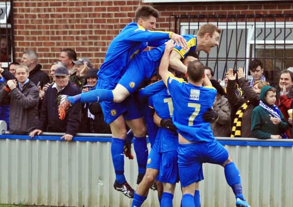 Courtney Baker-Richardson is mobbed by team-mates after giving Brakes the lead at Hungerford. Picture: Sally Ellis