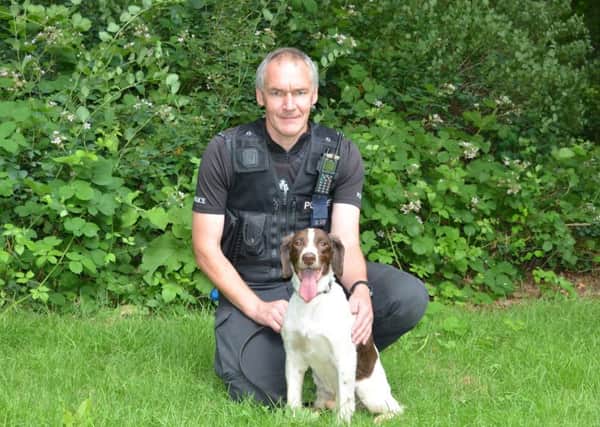 Pc Andy Crouch with police dog Jake. NNL-150528-111839001