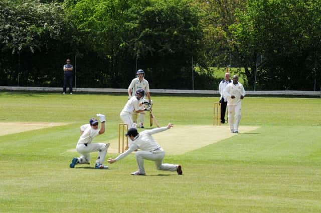 Shrewsbury 2nds' Toby Jones has a lucky escape as both wicketkeeper Jonathan Phillips and slip James Madley miss the ball off Paul Henderson's bowling. Picture: Morris Troughton