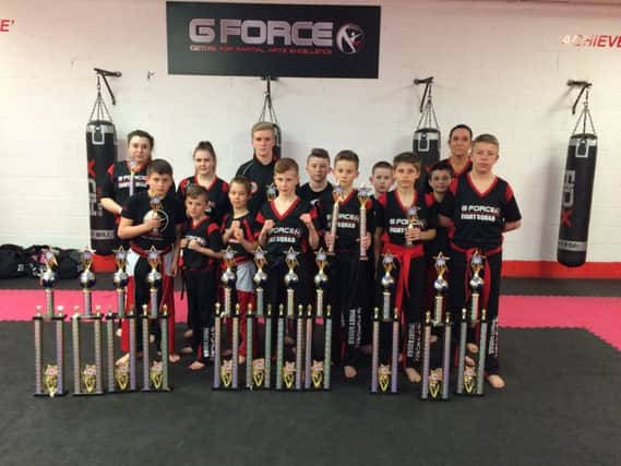 G Force Fight Squad with their trophies
