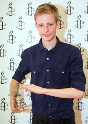 Max Owen with his Amnesty Youth Award.