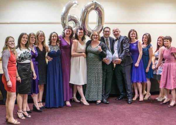 Volunteers for the Warwickshire Central branch of the NCT celebrate at the branch's 60th anniversary ball.