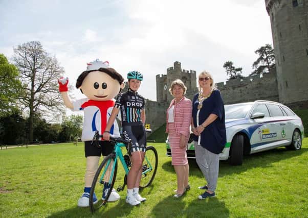 Hannah Payton of Drops Cycling Team with Cllr Izzi Seccombe and Cllr Mandy Littlejohn at Warwick Castle